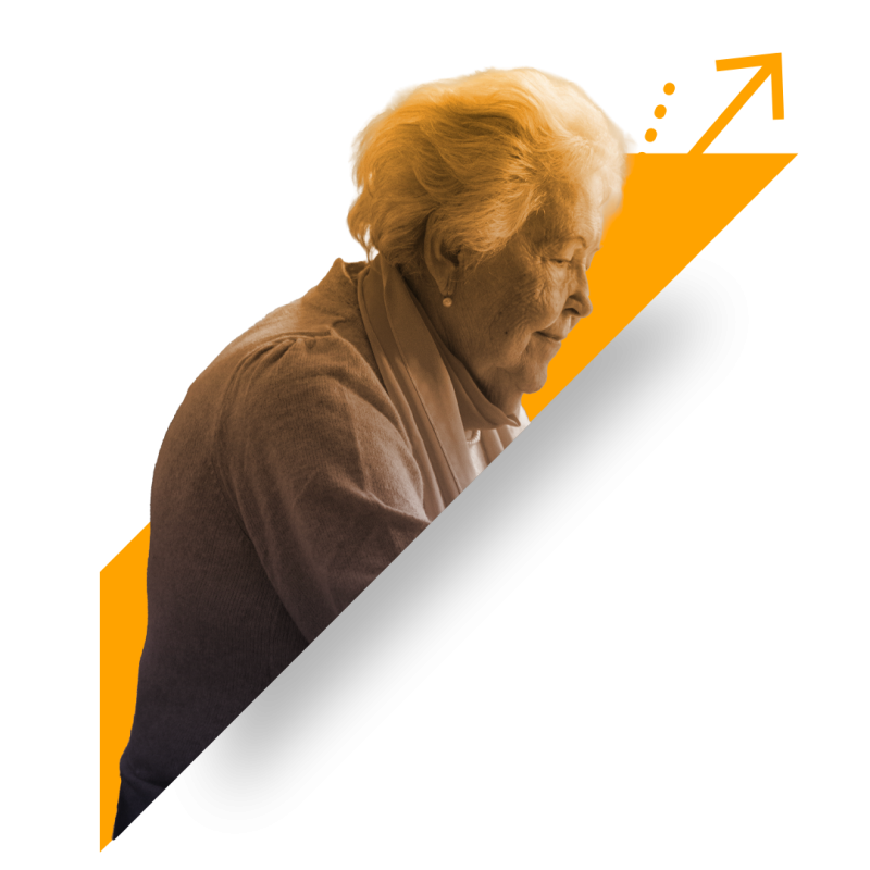 Elderly woman sat at a table